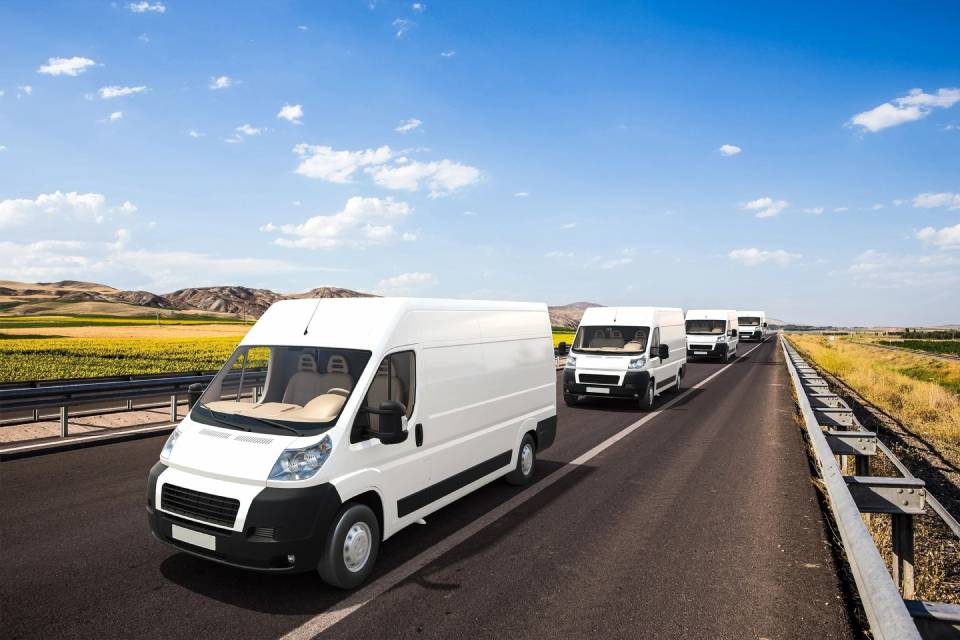 Several mini vans with beautiful background